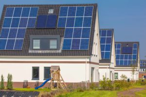 new-houses-with-solar-panels-in-a-modern-street-PNVH87W